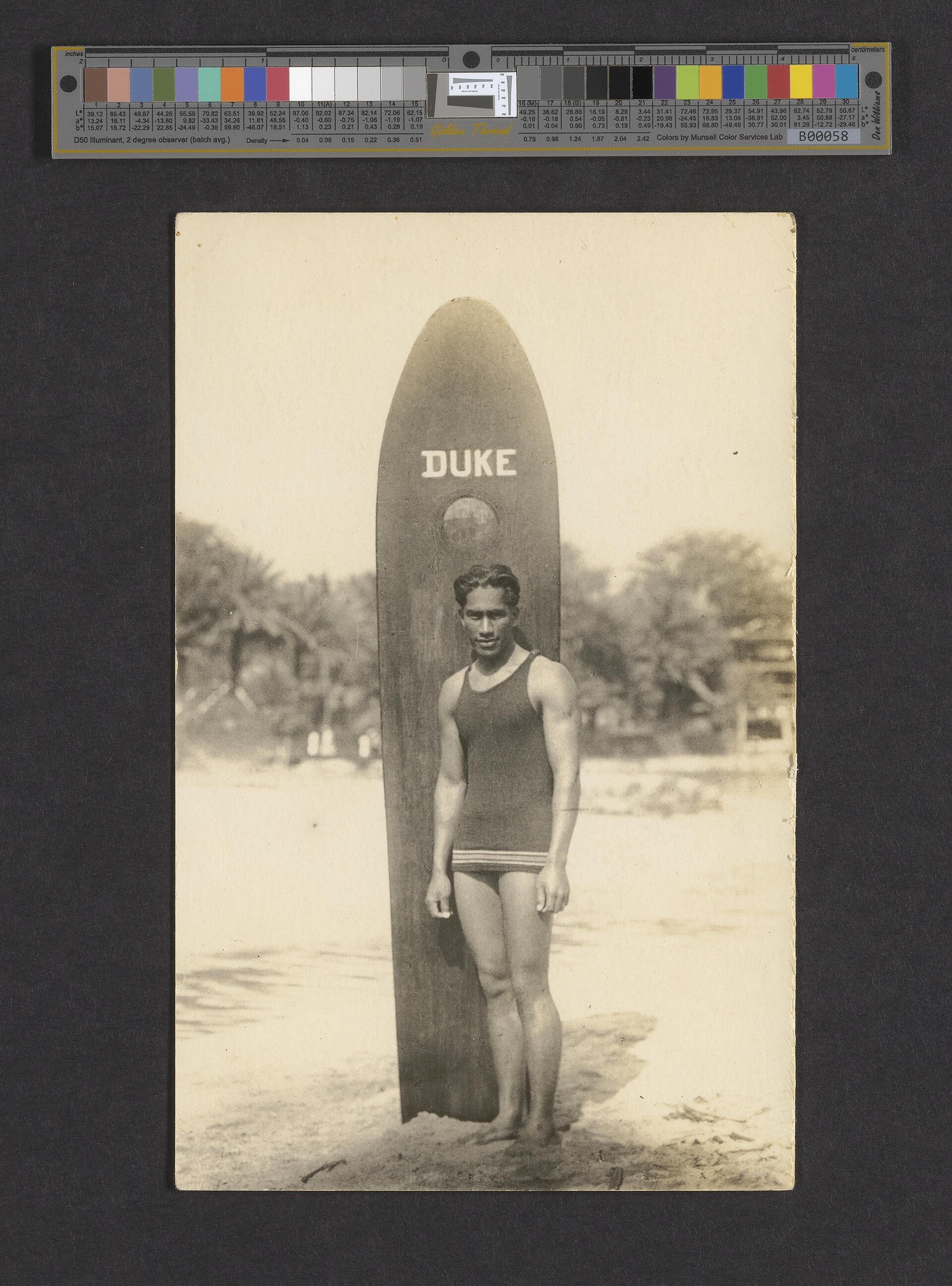 Duke Paoa Kahanamoku with his surfboard, c. 1910–15